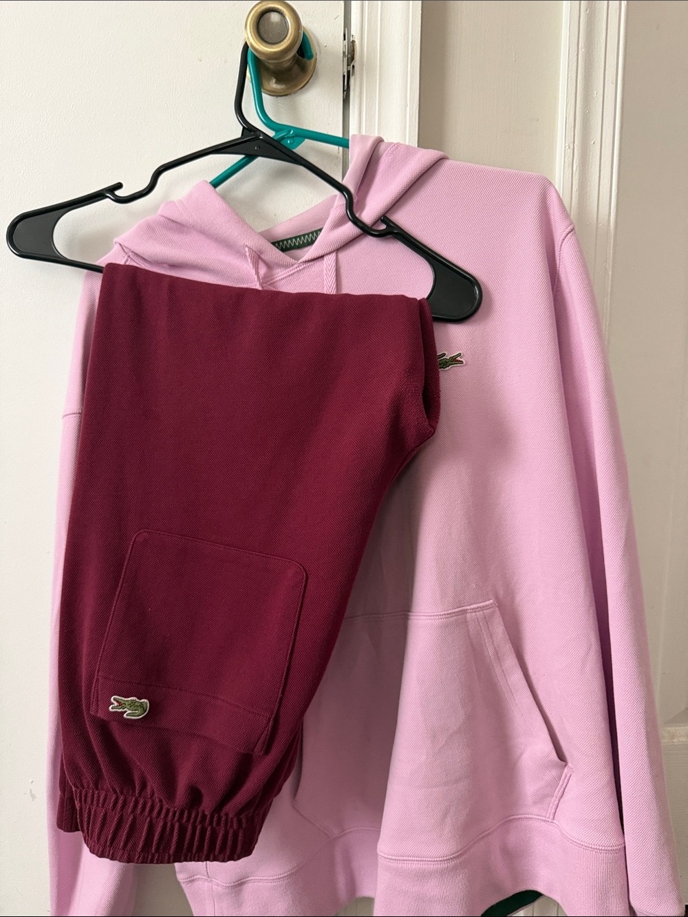 Women’s Lacoste Hoodie size 44 with Women’s Lacoste Burgundy sweatpants size 40.